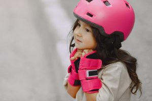 a photo of a kid wearing a helmet and protective gear