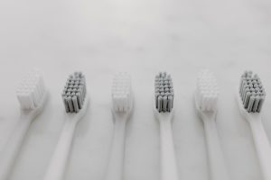 a close up picture of toothbrushes against a white background
